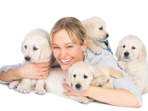 Lady hanging out with her cute puppies